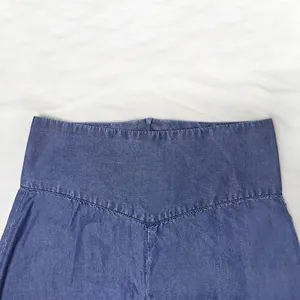 High-waisted dark blue denim A-line skirt with a clean waistline and back zipper closure