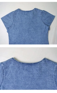 Detail view of the classic round neckline and stitching on a blue denim dress shirt