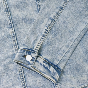 Classic slim fit light blue wash denim jacket with buttoned cuff and detailed stitching