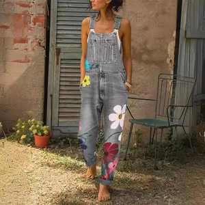 Classic gray denim overalls featuring vibrant large floral print with adjustable straps