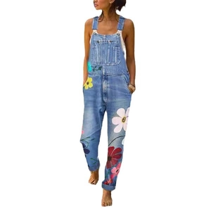 Women's light blue denim overalls featuring vibrant colorful floral prints and a loose fit