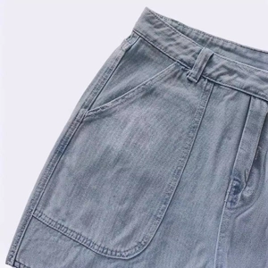 Women's light blue high waisted denim jeans featuring a classic zip fly and wash texture