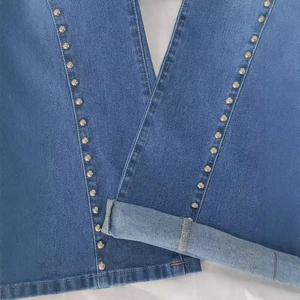 High waist flared denim jeans for women with metal rivets and cuffed hem detail