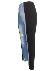 High-waist patchwork jeans with blue distressed denim and black contrast fabric