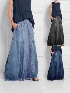 High-waisted A-line denim maxi skirt in light blue, gray, and dark blue with raw hem edge