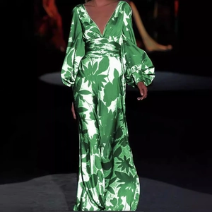 Elegant green floral print maxi dress with deep V-neck, puff sleeves and satin finish