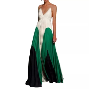 Detail of color-block pleated maxi dress featuring white, green, and black panel design