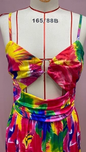 Detail of the tie-dye maxi dress featuring a sexy cutout bust and center metal ring