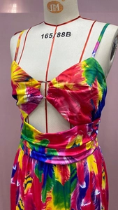Detailed view of tie-dye maxi dress with V-neck hollow out design and metal ring detail