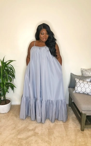 Detail view of thin straps and pleated chest on light blue summer maxi dress