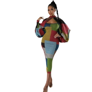 Detailed view of color-block knit dress with hollow-out chest and lantern sleeves
