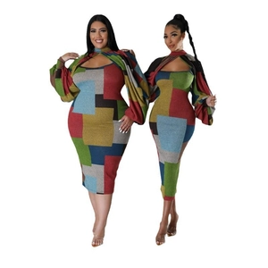 Detail of color-block geometric print on two-piece midi dress with puff long sleeves