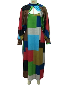 Detail view of colorful geometric patchwork print on long sleeve maxi dress and cardigan