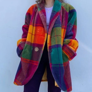 Detailed view of colorful oversized plaid wool coat with large lapels and metal button