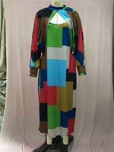 Detail view of colorful geometric patchwork pattern on two-piece maxi dress set