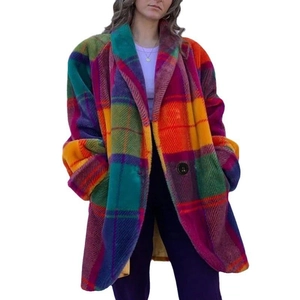 Close-up of vibrant multicolored oversized plaid wool coat with textured fabric detail