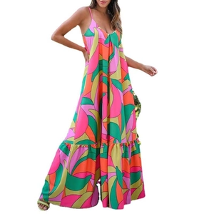 Detail of bohemian maxi dress with vibrant abstract print and ruffled tiered hemline
