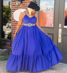 Detail of royal blue V-neck maxi dress with spaghetti straps and zebra pattern belt