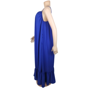 Detail view of the deep blue sleeveless summer dress with ruffled hem on a mannequin