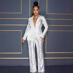 Elegant two-piece white sequin suit featuring deep V-neck blazer and wide-leg trousers