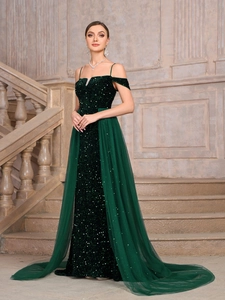 Elegant dark green sequin evening gown with a long tulle train for formal parties