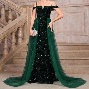 Detail of sequins and tulle on dark green evening gown with off-shoulder sleeves