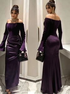 Detail of elegant dark purple satin evening gown featuring off-shoulder long flared sleeves