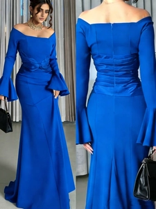Royal blue off-shoulder evening gown featuring flared sleeves and pleated waist details