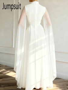 Elegant white wide-leg jumpsuit with high neck and long sheer cape sleeve back view
