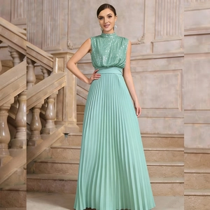 Detailed view of sequined sleeveless bodice and pleated mint green long evening dress
