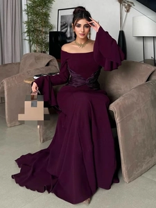 Elegant off-shoulder evening gown with layered bell sleeves and pleated waist detailing