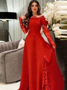 Elegant wine red evening gown with lace sleeves and high slit for party wear