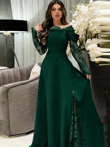 Elegant emerald green evening gown featuring off-shoulder lace neckline and side slit detail