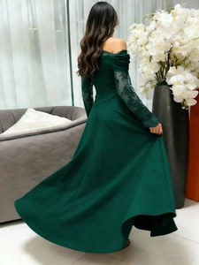 Detailed back view of dark green off-shoulder evening gown with lace sleeves