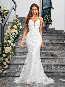 Elegant white lace mermaid evening gown with spaghetti straps and deep V-neckline