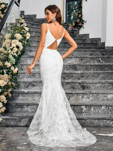 Elegant white lace mermaid evening gown with spaghetti straps and long trailing hemline