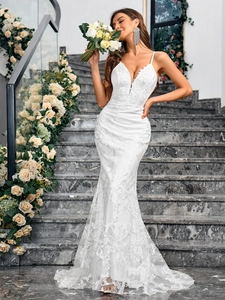 Elegant white lace mermaid evening dress with deep V-neck and delicate train detail