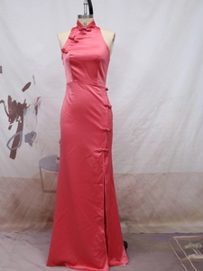 Detail of coral pink satin cheongsam with high side slit and traditional mandarin collar
