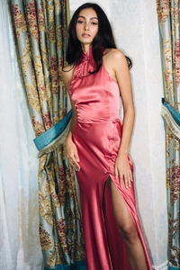 Detail of pink satin halter qipao dress showing traditional knot buttons and silky fabric