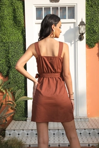 Back view of a rust brown sleeveless dress featuring thick straps and a waist tie belt