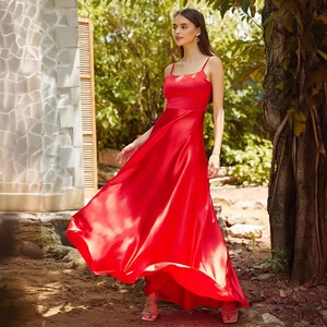 Elegant red floor-length satin evening dress with thin straps and a flowing A-line skirt