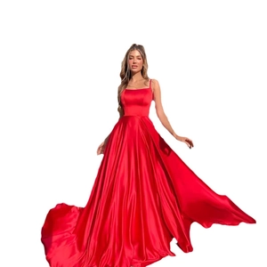 Elegant red satin evening dress with thin straps and a flowy maxi skirt for formal parties
