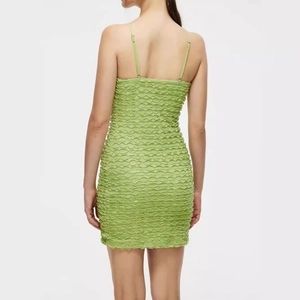 Grass green bubble textured mini dress with slim fit spaghetti straps and bodycon style