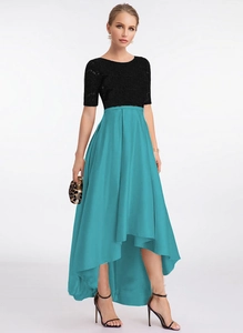 Detail of elegant black lace bodice and high-waist blue satin high-low hem evening dress