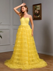 Elegant yellow sleeveless lace tiered evening dress with a layered ruffle skirt design