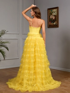 Elegant yellow tiered tulle evening gown with open back and lace details