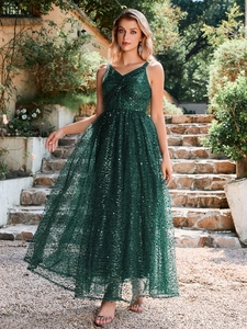 Detailed view of dark green sequin V-neck maxi dress featuring wave patterns and shimmer