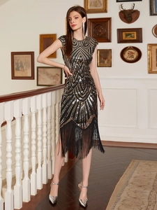 Elegant vintage 1920s Gatsby sequin dress with gold fringe and geometric wave pattern