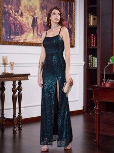 Elegant deep green sequin evening gown with spaghetti straps and a high side slit detail