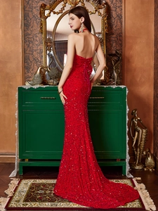Elegant red sequin mermaid evening gown with backless criss-cross straps and small train